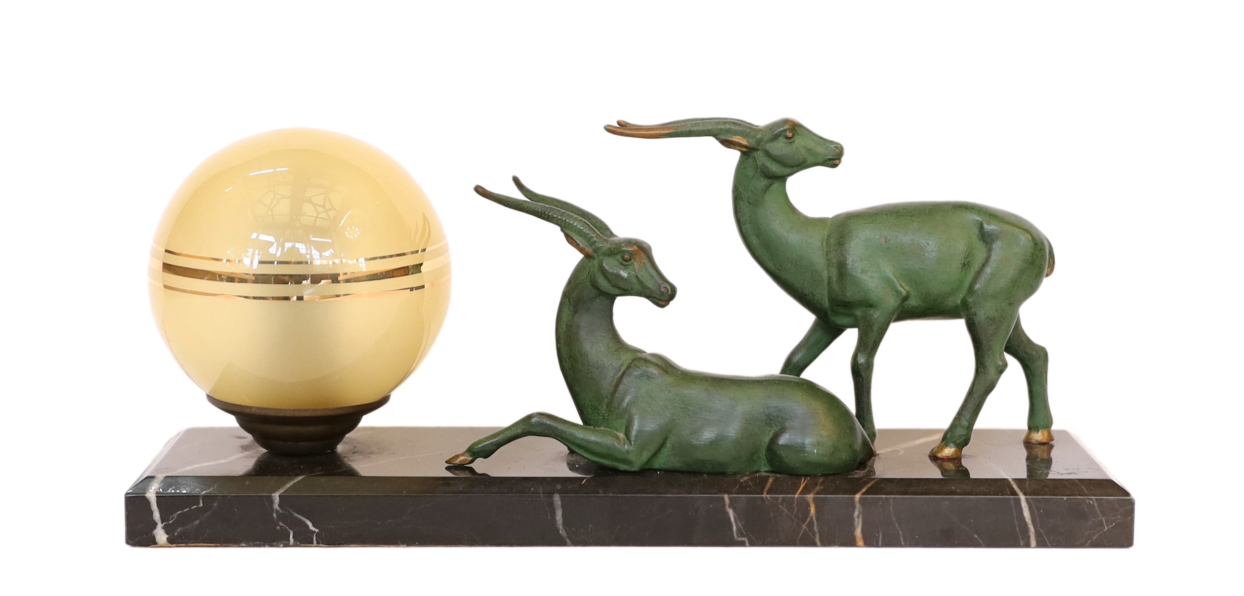 An Art Deco French bronze spelter and marble gazelles table lamp with etched spherical shade, height 10cm. width 32cm